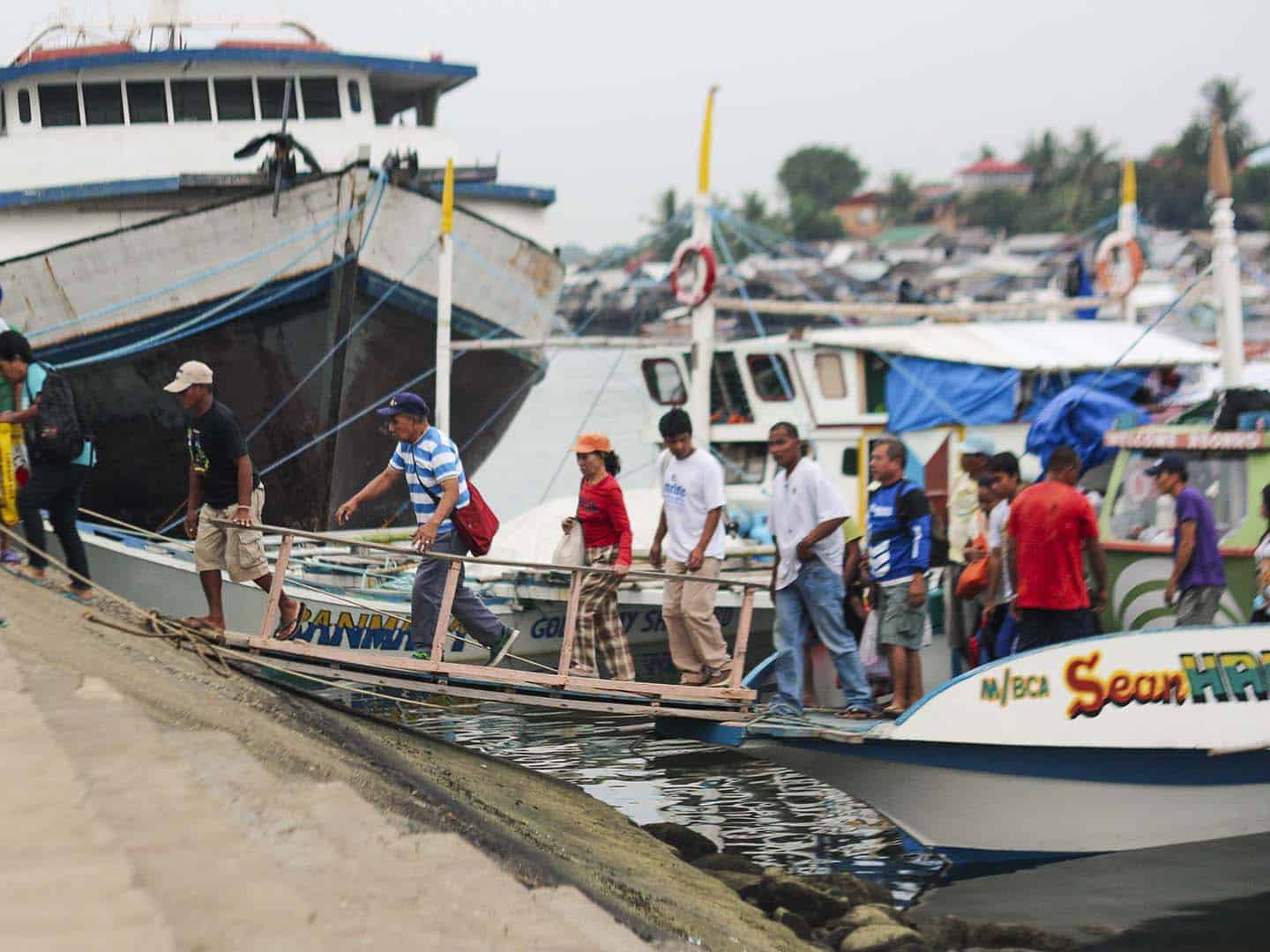 A banka is a wooden boat with outriggers used by Filipinos