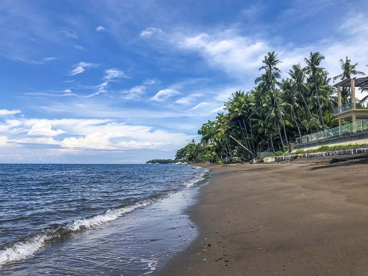 Black sands of San Miguel, Dauin