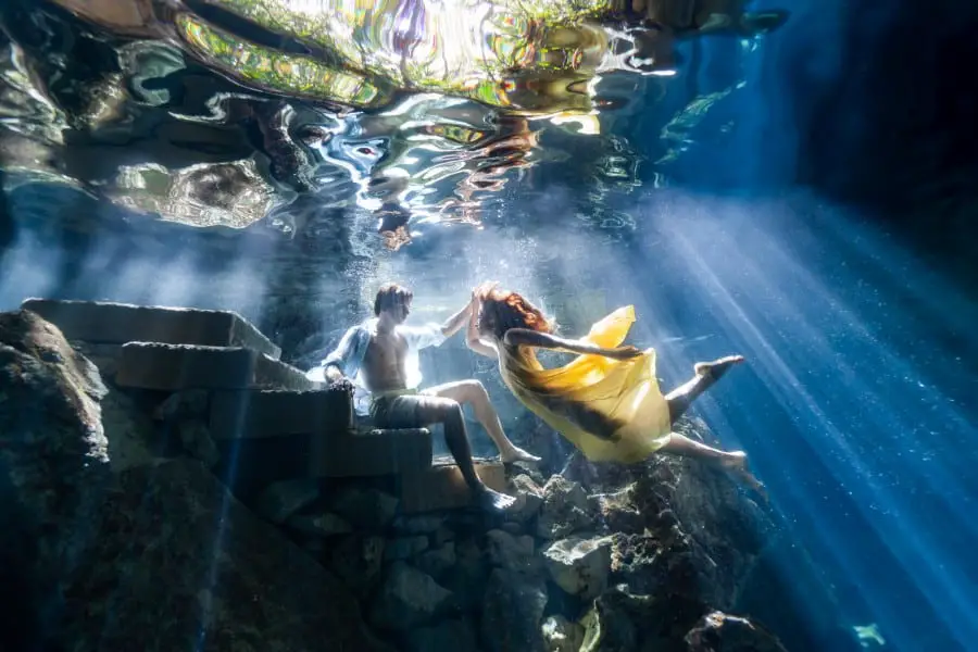 A couple shoot during a cenote photoshoot with Fran Reina.