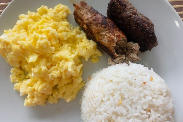 Homemade sausages, scrambled eggs and rice