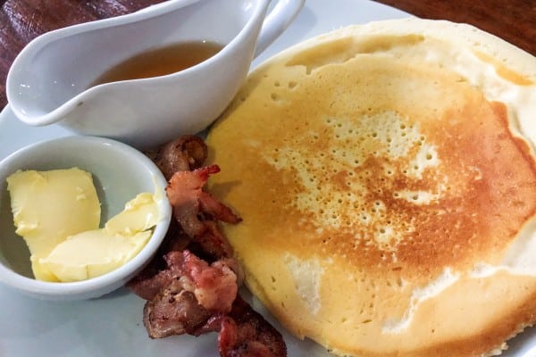 Pancake with butter, syrup and bacon