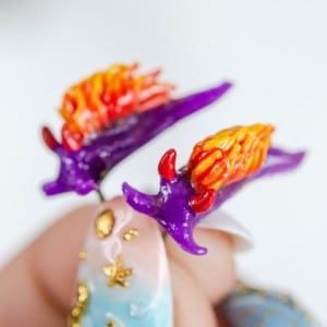 Spanish Shawl Nudibranch (Flabellina iodinea) glow in the dark earrings by
The Sea Slug and Kraken