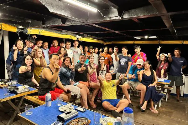Crew and guest on MV Resolute's Coron-Apo Reef-Puerto Galera liveaboard
